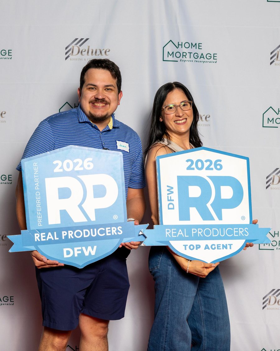 Yary Diaz and Juan Sanchez holding DFW Real Producers 2026 signs